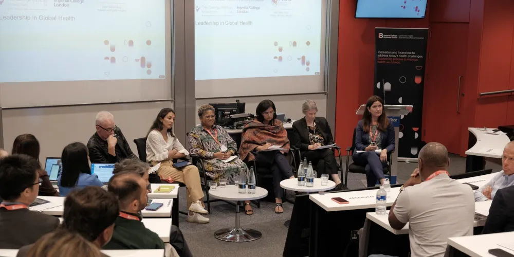 Photo of lecture theatre with panellists seated at front